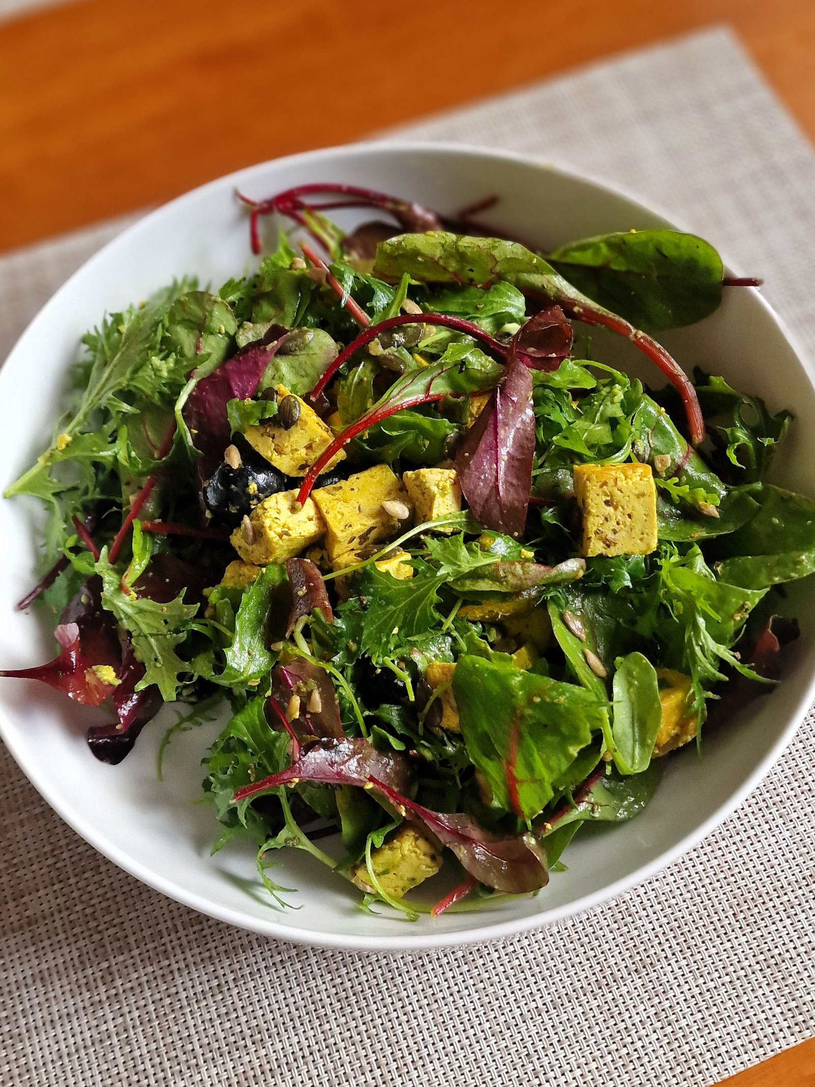 Tofu salad with greens and blueberries